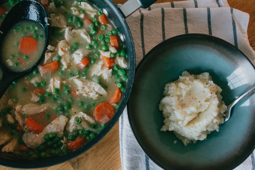 Thickened chicken soup over mashed potatoes