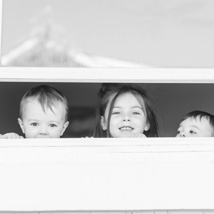 3 kids at the window