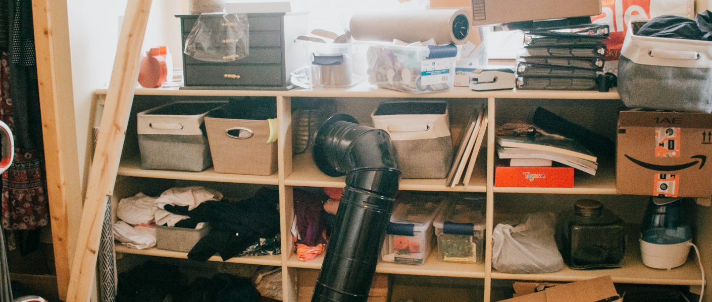 cluttered master closet