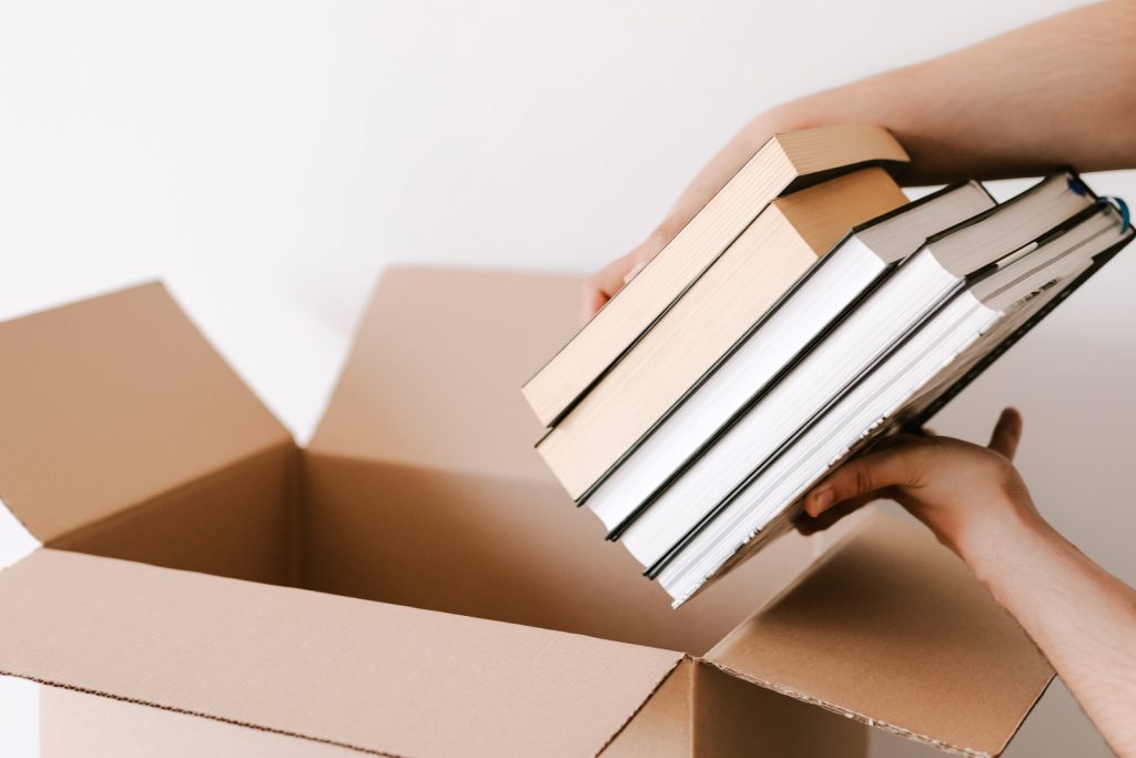 putting books in donation box