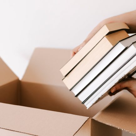 putting books in donation box